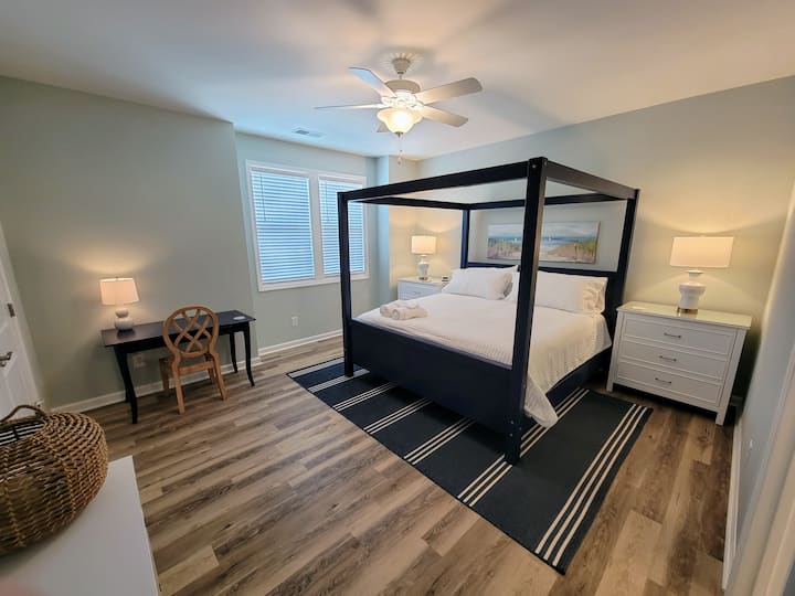 The master bedroom, on the third level, features a king-size bed and a workstation which includes a monitor (not shown) that can be used if you absolutely must check in with the office while on vacation.