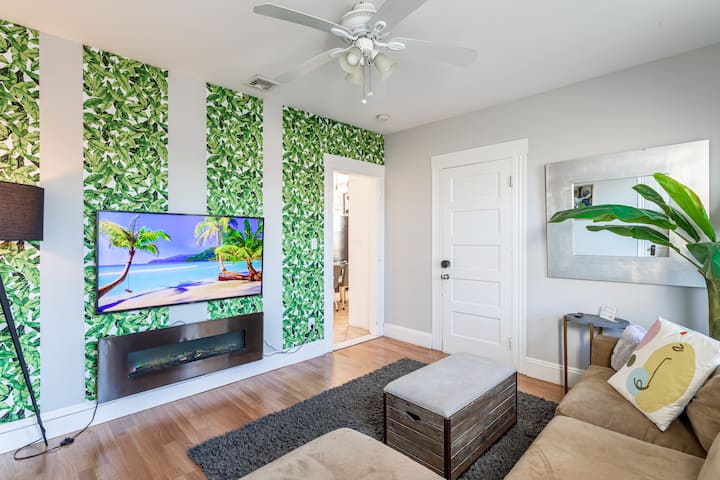 Spacious living room, modern entertainment, cozy furniture. Rest in an Airbnb full of charm and functionality. 