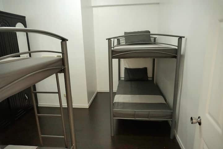 Second bedroom with 2 bunkbeds (double deckers) and window type aircon