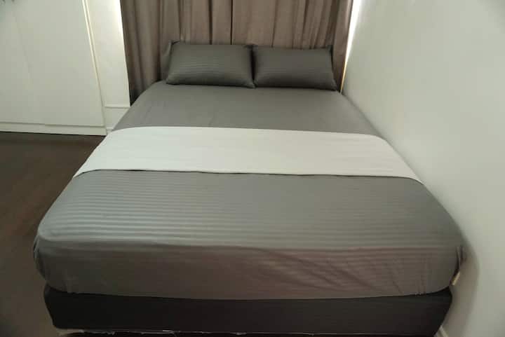 Master bedroom with queen size bed and split type aircon