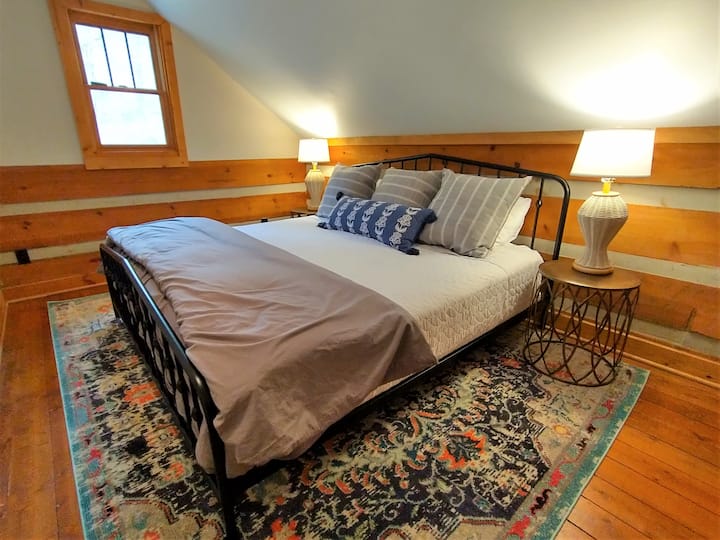 Second bedroom upstairs includes a king size bed.  Open the window and listen to the stream flow by as you fall asleep.