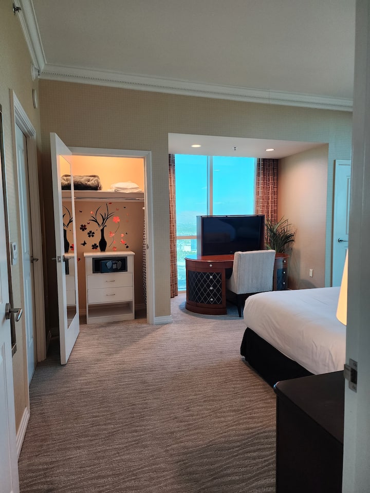 bedroom with a safe in the closet