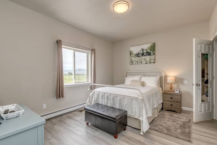 Primary bedroom has a queen bed and the walk in closet holds all of the bathroom towels