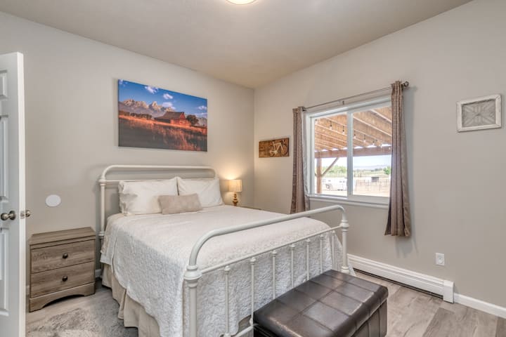 Second bedroom has a queen bed and walk in closet holds the pack and play, high chair, a lot of board games and a large variety of carefully selected literature for your use during your stay