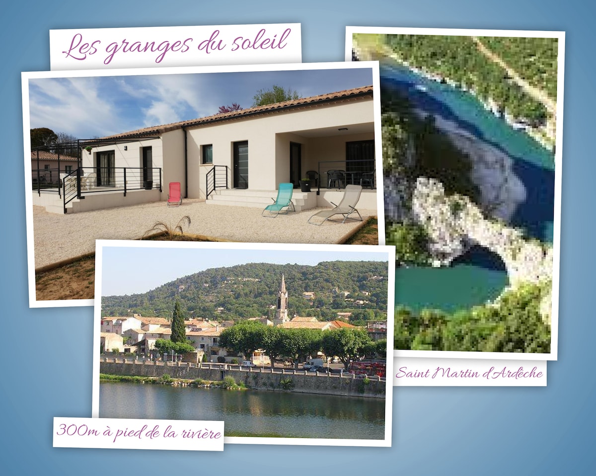 The image features a modern building with a light exterior and large windows. Colorful lounge chairs are positioned outside on a gravel area. A view of the village with hills in the background is also captured, alongside a scenic river and rocky landscape, promoting a peaceful environment.