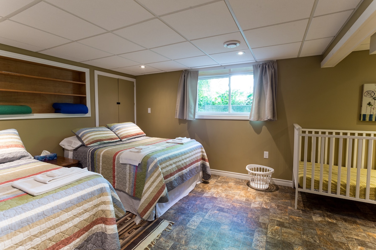 Bedroom 3 - Family Style bedroom with two double beds and a full sized crib.