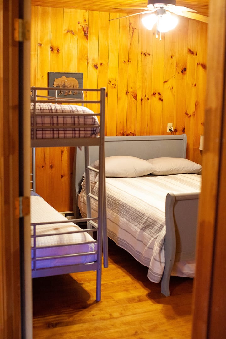 Bunk room main level, full bed and two twins. 