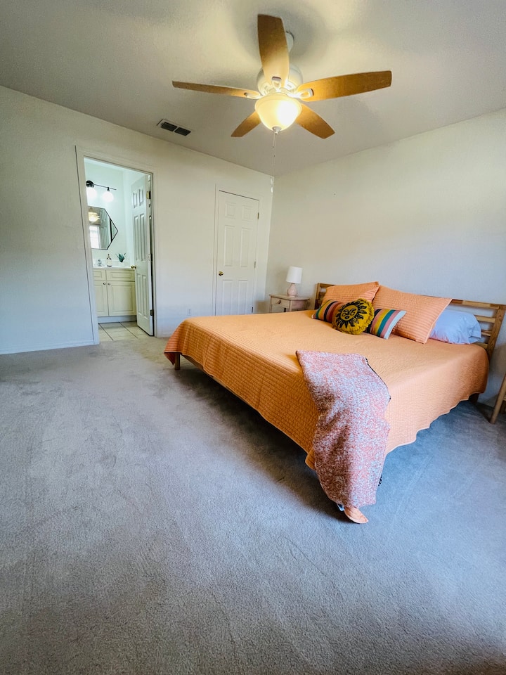 Bedroom with King bed and attached full bathroom.