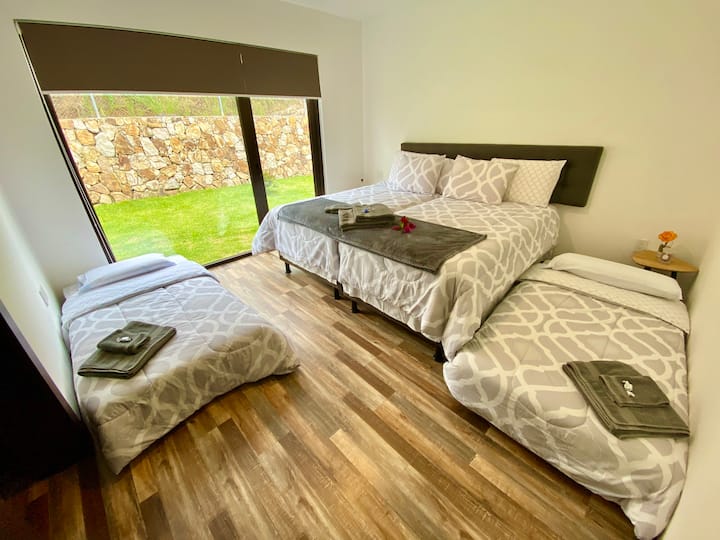 Room 1 in four-seater setup. Queen bed and two single beds. All with mattresses and shafers Chaide state of the art. Duvets. Single beds move with wheels to any part of the spacious room. 