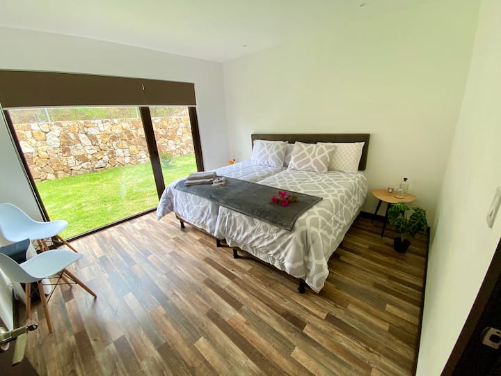 Room 1 in a two-pronged configuration with a queen size bed. Chaide state-of-the-art mattresses. Nordic duvets. 