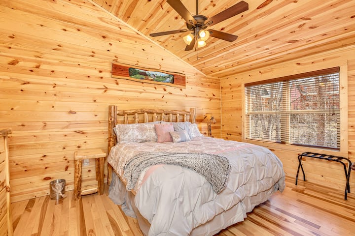 1 of 2 bedrooms with TV, closet & bathroom.