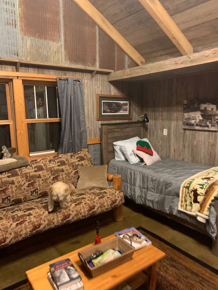Bunkhouse with many amenities. Two single beds, two pull out beds! Sleeps 2-4!  (2 additional fold up single beds can be added to the adjoining game room)  The Bunkhouse is Included with the Farmhouse! Note:  guests use farmhouse bathrooms/showers