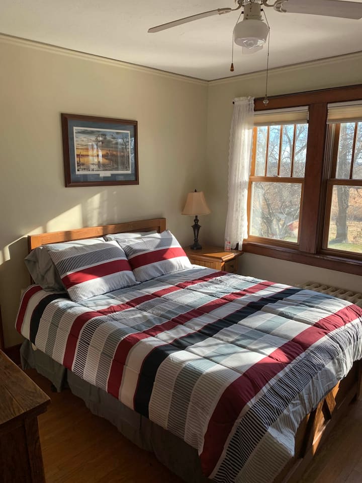 South Bedroom looks out over miles of corn fields! "Knee High by the 4th of July". USB charging, huge walk-in closet. Welcome gift! Spa slippers, head massager and more....