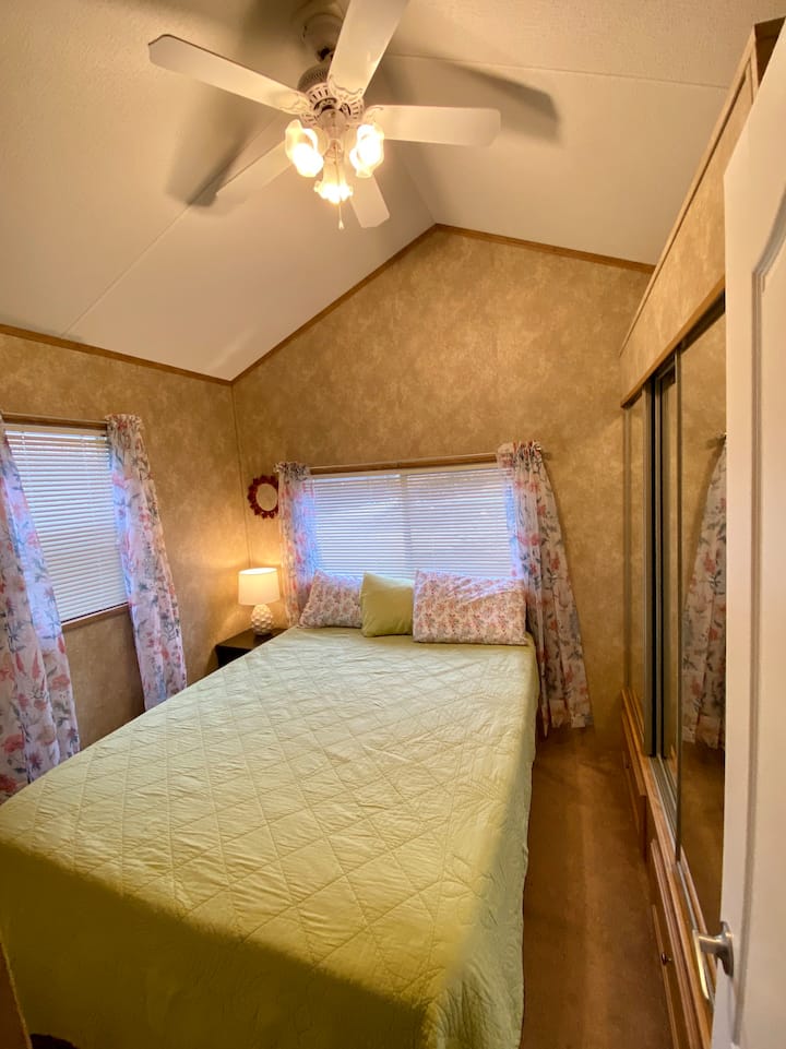 bedroom with a queen memory foam mattress bed.