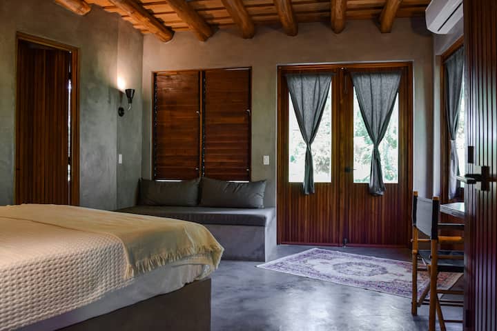 Master bedroom 1, Ensuite bathroom, double French doors that access yard. 