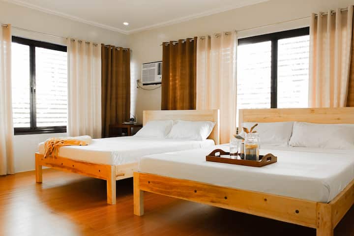 The first bedroom comes with two king-sized beds. Its pillows and mattresses are soft, clean, and comfortable. 