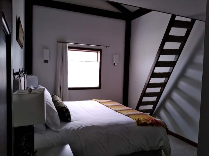 Upper bedroom #2 features a king bed, and bonus loft area.