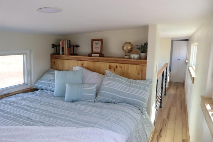 Master bed with storage at headboard.