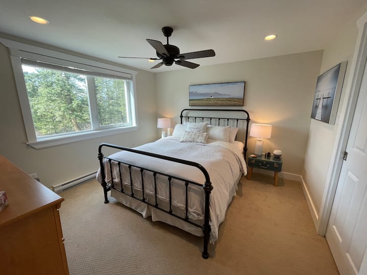 enjoy a sleep-in with this master bedroom in the trees