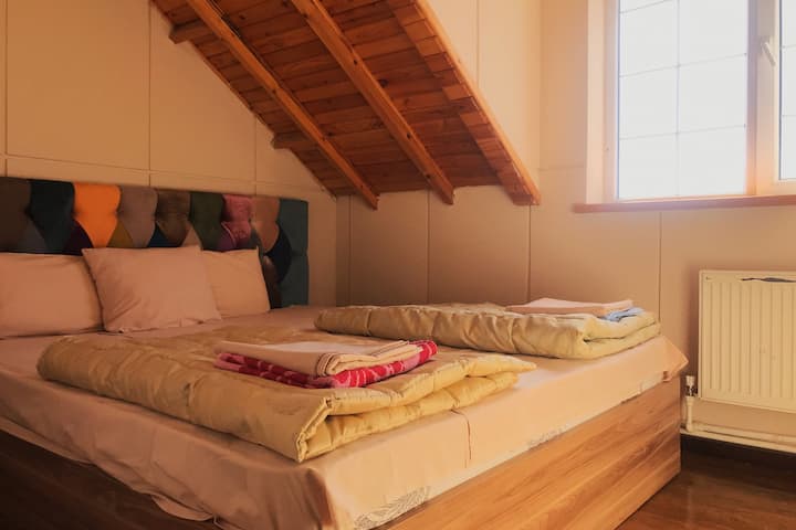 This is bedroom with full bed.