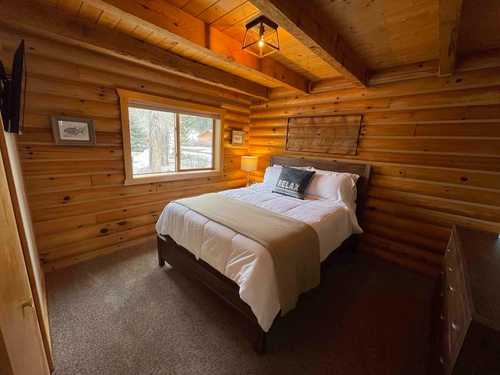 Guest Bedroom with Queen Bed and Flat-Screen TV.