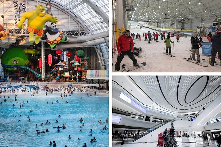 A vibrant scene captures guests enjoying a large indoor water park, featuring colorful slides and a spacious pool area filled with swimmers. Above, animated characters suspended from the ceiling create a playful atmosphere.