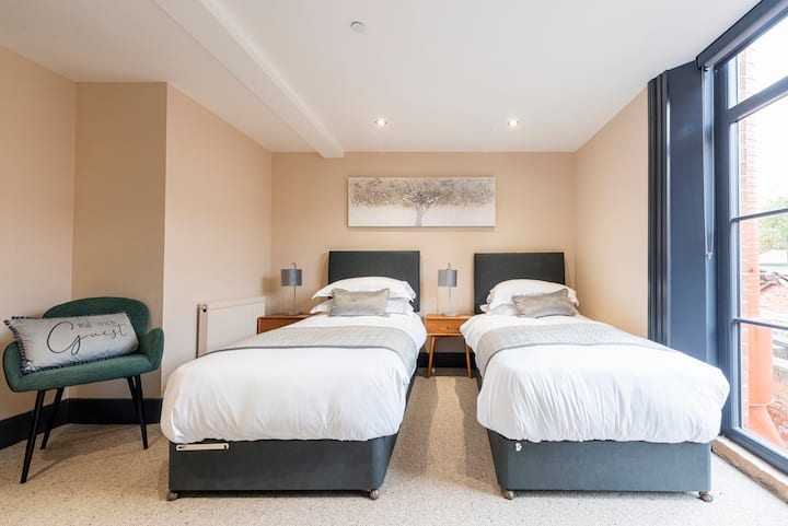 Downstairs bedroom with en suite, guests can request a King size bed or 2 singles.