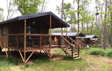 4 wooden cabins side by side in Chanteloup