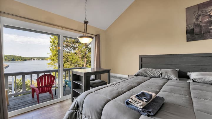 Main Level Bedroom #1: Double King-size beds with a private full bathroom, pub table, private balcony, and cable TV.