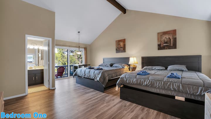 Main Level Bedroom #1: Double King-size beds with a private full bathroom, pub table, private balcony, and cable TV.