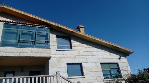 Modern Stone House by the beach. En Outes.