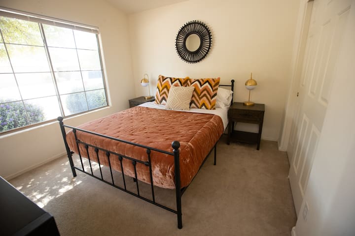 Queen bedroom with night stand, dress and closet. Smart Tv has been added.