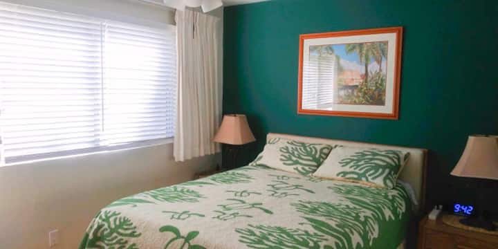 Queen size bed, clock, and additional window shades just in case you want to sleep in.