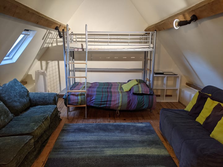 Dormitory/Dortoire (sleeps 5). There's a bunk bed that is double (convertible) on the bottom and single on the top. Also another double bed. The perfect kids' hideout with a strong fiber optic internet signal and a nice soundbar for playing music. 
