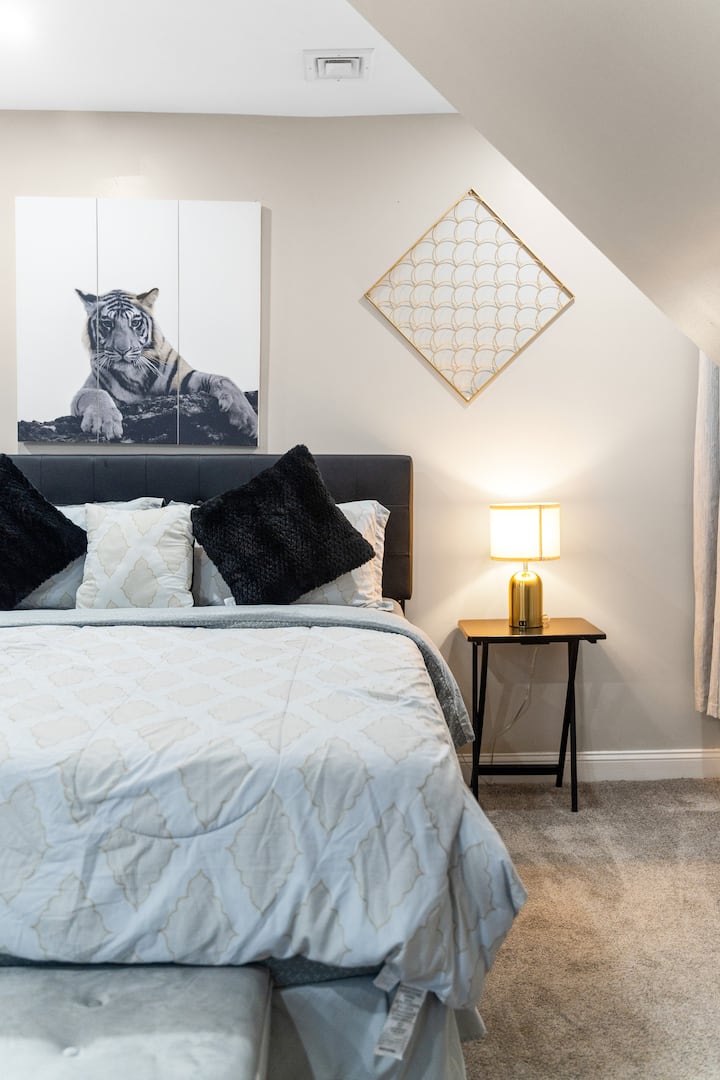 Bedroom 1 with soft glow of the lamp welcomes you to unwind and relax.