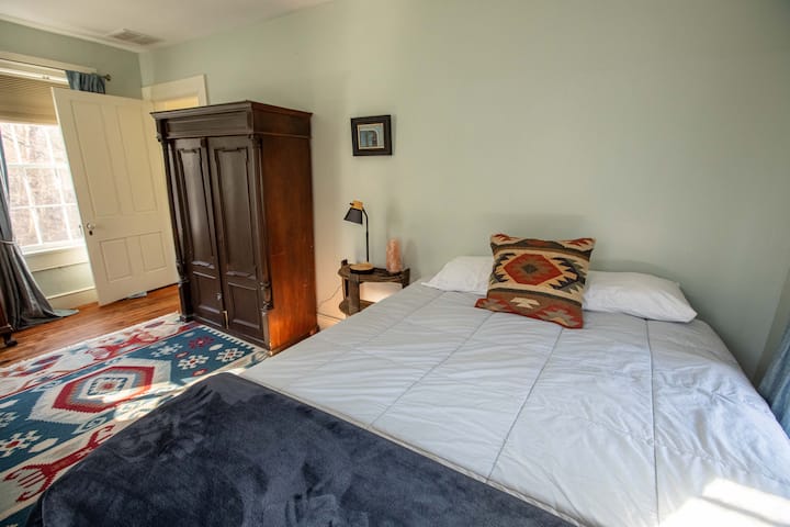 Back bedroom with a new queen-sized Avocado mattress.