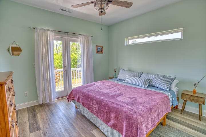 Master suite with king sized bed and large front patio.
