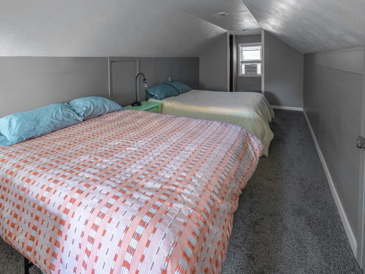 The upstairs loft includes two queen-sized beds. It's perfect for kids or larger groups!