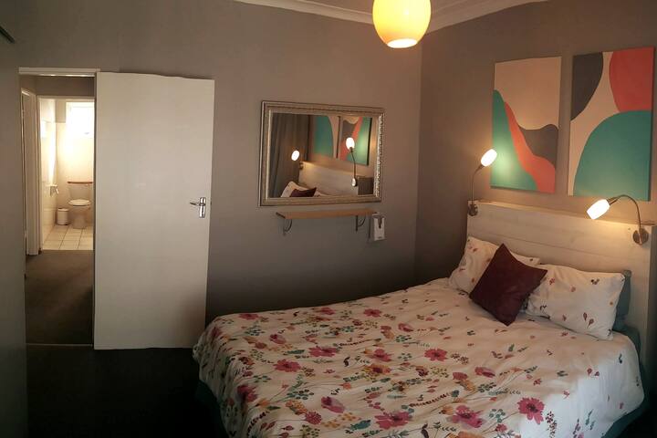 The second bedroom with queen size bed and has a sliding door that opens on the balcony.