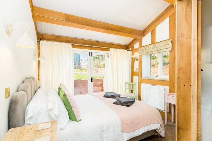 Bedroom 1 is so beautiful and sets the standard for all bedrooms. King size,en-suite . Patio doors leading to outside area