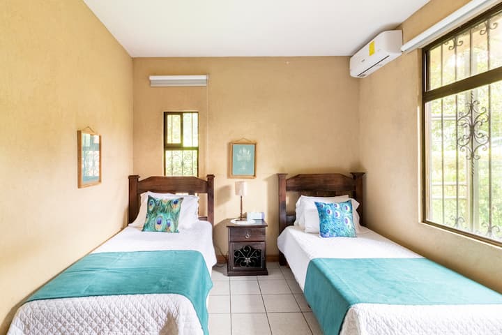 Third bedroom has two twin beds. It has AC and its own bathroom. 