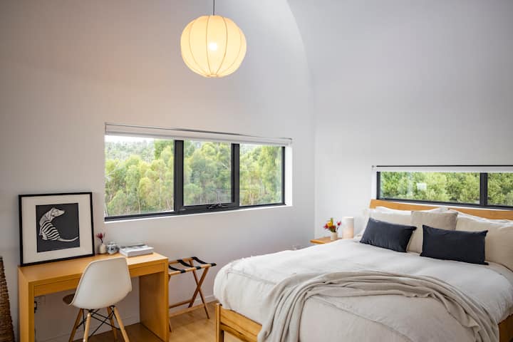 Primary bedroom featuring high loft doona, French linen sheets, goose down pillows, and electric blankets.