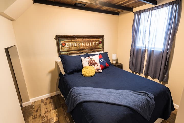 Downstair bedroom 1 featuring a full size bed 