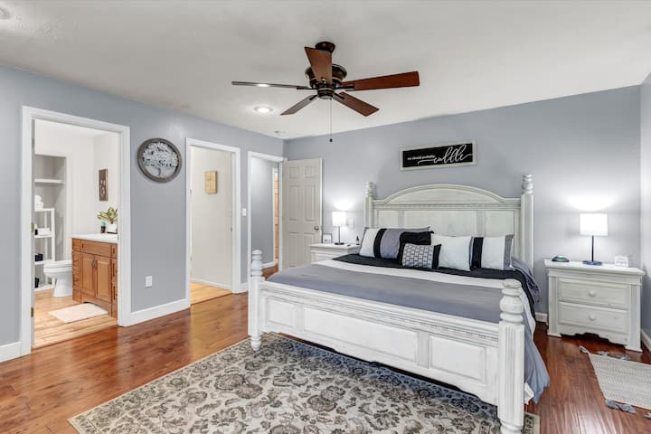 Master bedroom featuring a memory foam king bed, luxury linens, large master bath, smart tv, outside entrance, just steps to the back deck, hot tub and Pigeon river!