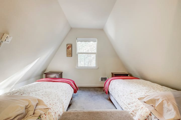 referred to as the drop down room - two twin bed on either side of the stairs that step down into the room off the common room upstairs