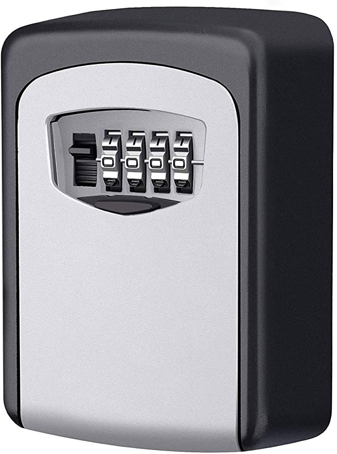 A combination lockbox is displayed, featuring a sleek silver and black design. Four rotating dials are positioned at the front, allowing for secure locking and key storage. The overall shape is compact and rectangular, suitable for mounting on a wall.