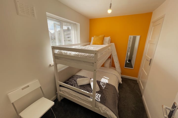 Bedroom 3 - Bunk Bed with x 1 Single Bed and x 1 Double Bed, with desk, side drawers and wardrobe space.