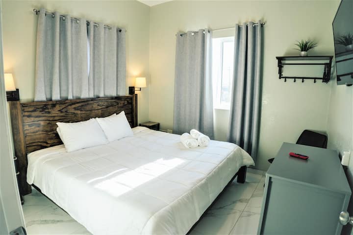 Suite #2 with King memory foam bed, 42 inch smart tv, dresser & ceiling fan 