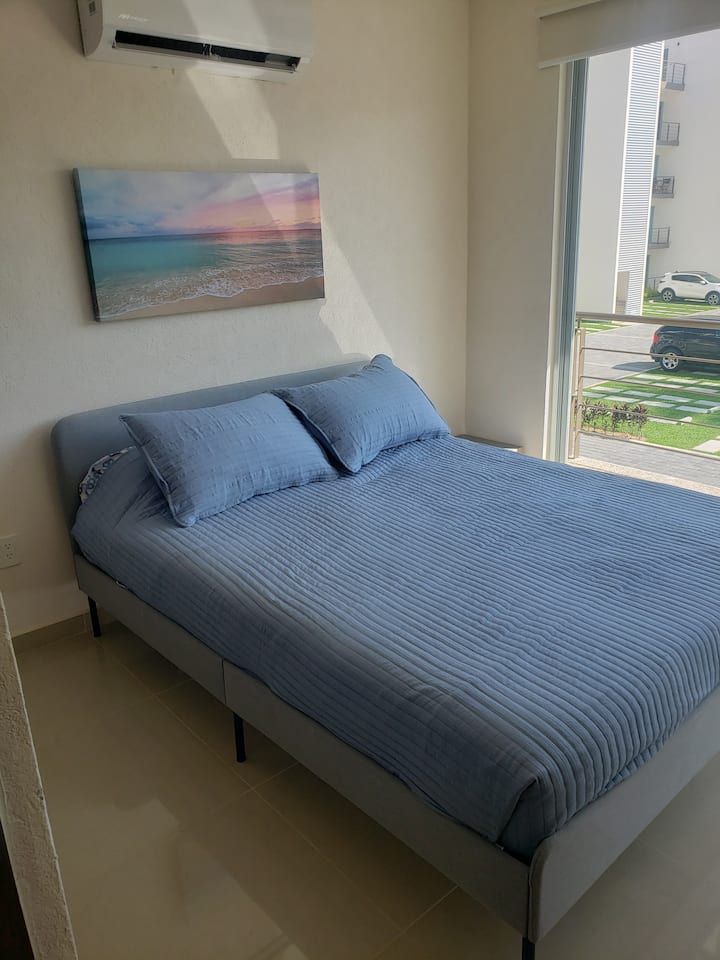 Bedroom overlooking the pool.