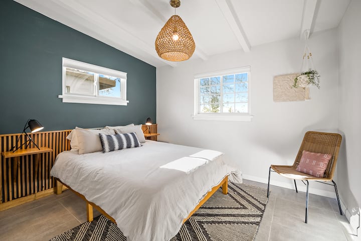 Bedroom two has a comfy queen bed with custom built in headboard